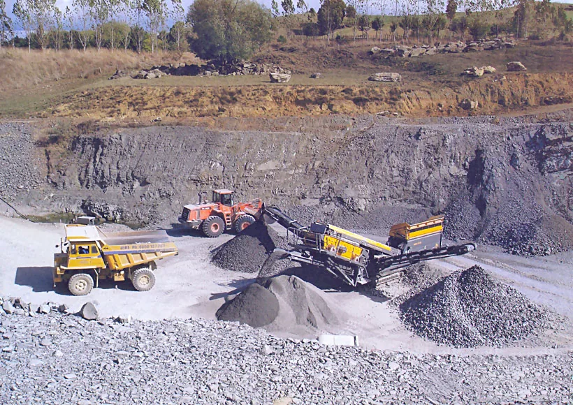 Close view of a Cronus trailer mobile crushing plant chassis with tri-axle wheels
