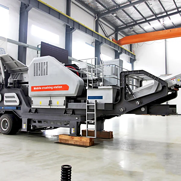 Wheeled portable crushing station discharging graded aggregate at a stockyard