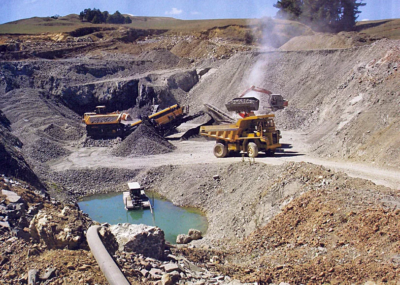 Open pit mining operation served by a Cronus tire mounted mobile crusher