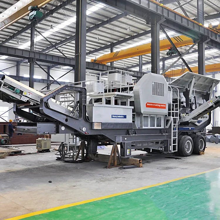 Tire type mobile crushing plant being towed on a highway to the next contract site